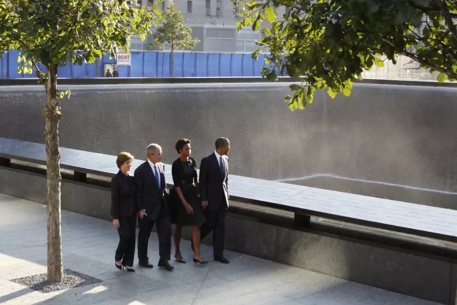 President Barack Obama, first lady Michelle Obama, former president George W. Bush and former first lady Laura Bush walk besid...al during ceremonies marking the 10th anniversary of the 9/11 attacks on September 11, 2011. (Larry Downing/ courtesy Reuters)