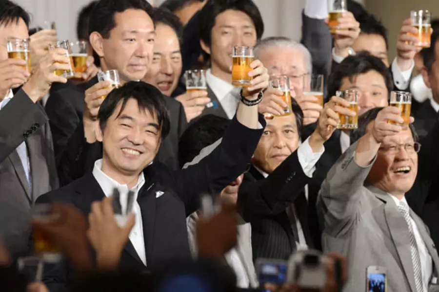 Osaka Mayor Toru Hashimoto toasts with members of his new Japan Restoration Party at a fund-raising party in this photo taken by Kyodo in Osaka