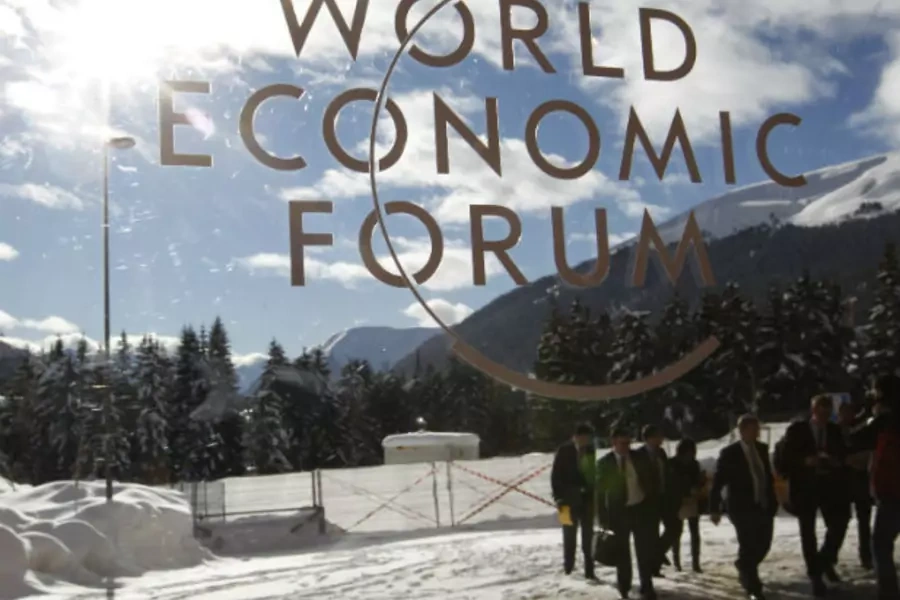 Visitors are reflected in window of the congress center, venue of the World Economic Forum (WEF) in Davos (Arnd Wiegmann/Courtesy Reuters).