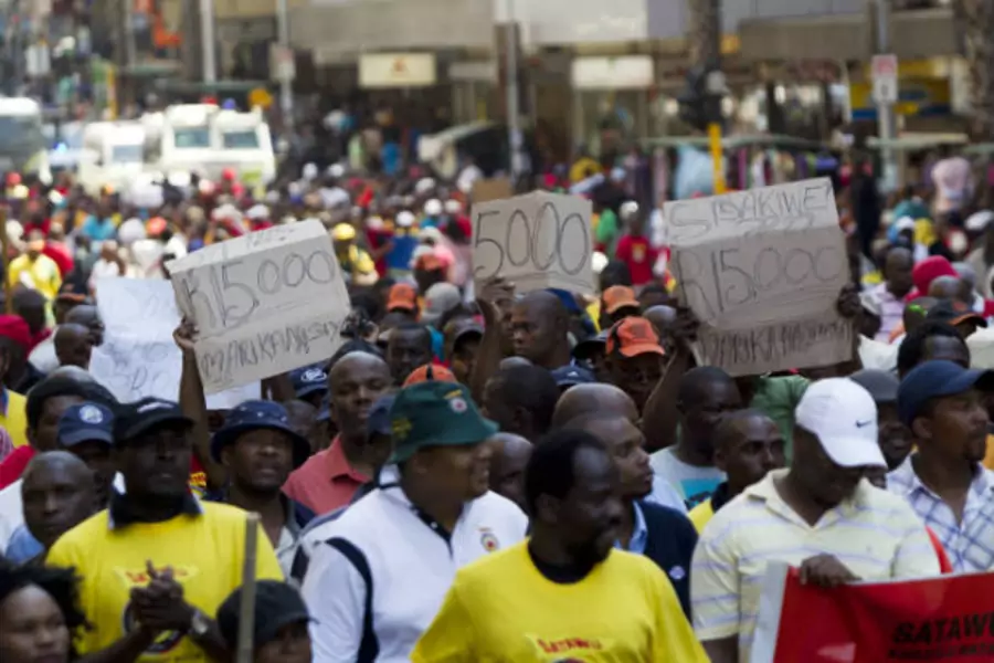 Workers in the freight sector belonging to the South African Transport and Allied Workers Union (SATAWU) march through the Durban central business district, demanding an increase in salary on September 26, 2012 (Rogan Ward/Courtesy Reuters).