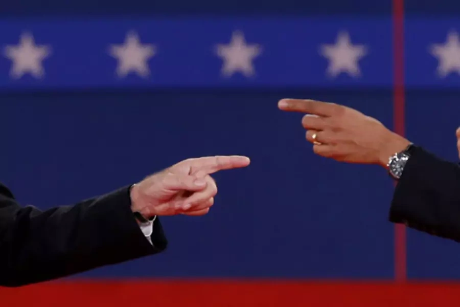 Mitt Romney and Barack Obama point fingers during the second presidential debate. (Mike Segar/ courtesy Reuters)