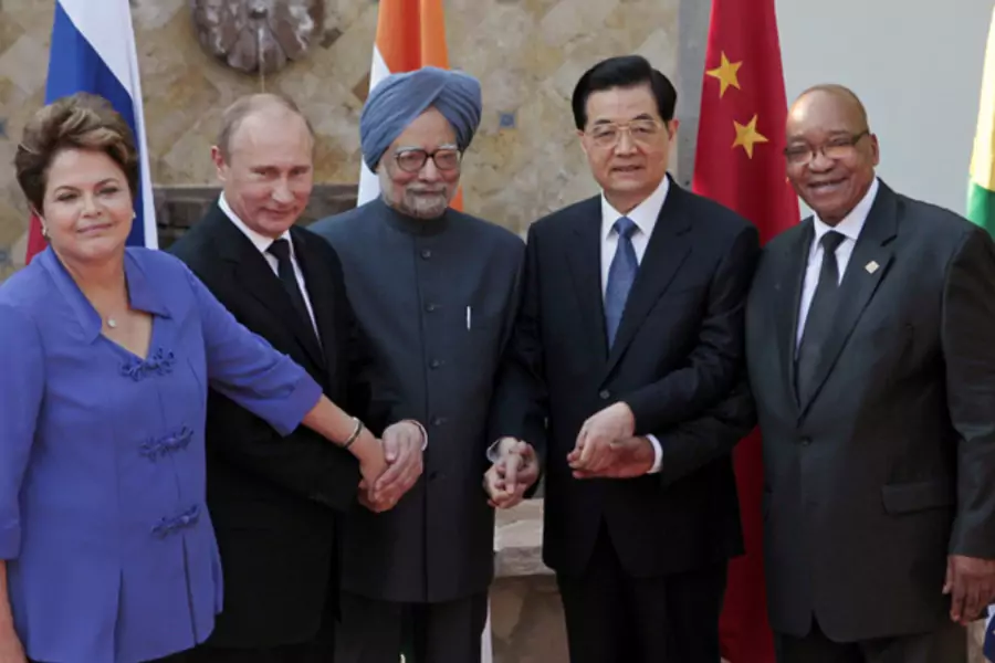 (L-R) Brazil's president Dilma Rousseff, Russia's president Vladimir Putin, India's prime minister Manmohan Singh, China's pre...Hu Jintao and South African president Jacob Zuma pose for a picture after a BRICS leaders' meeting in Los Cabos June 18, 2012.