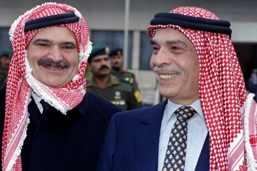 Jordan's King Hussein (R) and Crown Prince Hassan pose for photographers at Amman airport February 11, 1996. (Courtesy REUTERS).