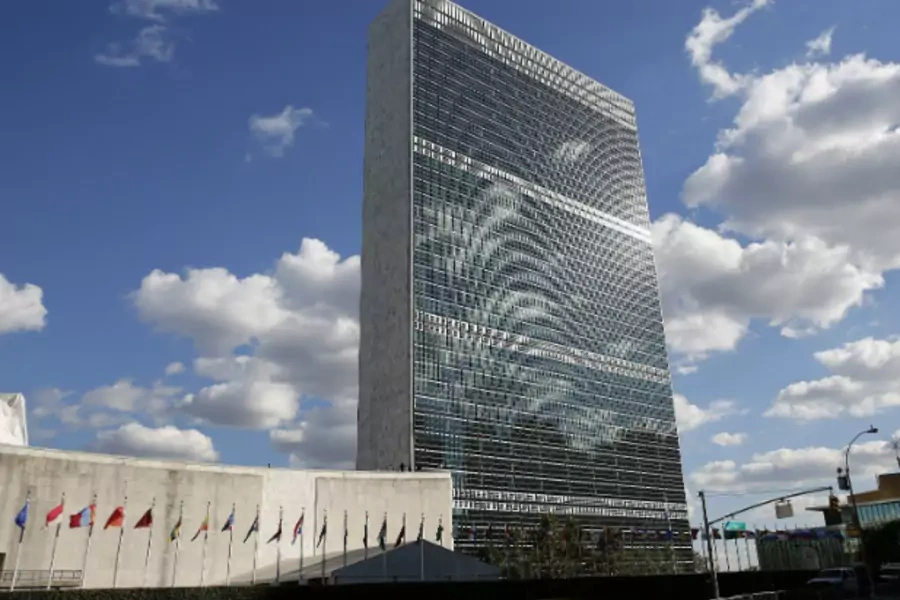 Clouds are reflected off the Secretariat Building (C) of the UN headquarters during the 67th United Nations General Assembly, in New York, September 24, 2012. (Courtesy REUTERS/Chip East)