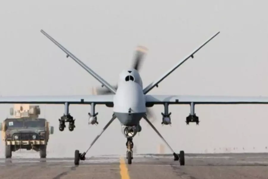 An armed unmanned Reaper drone prepares for takeoff (Handout/Courtesy Reuters).