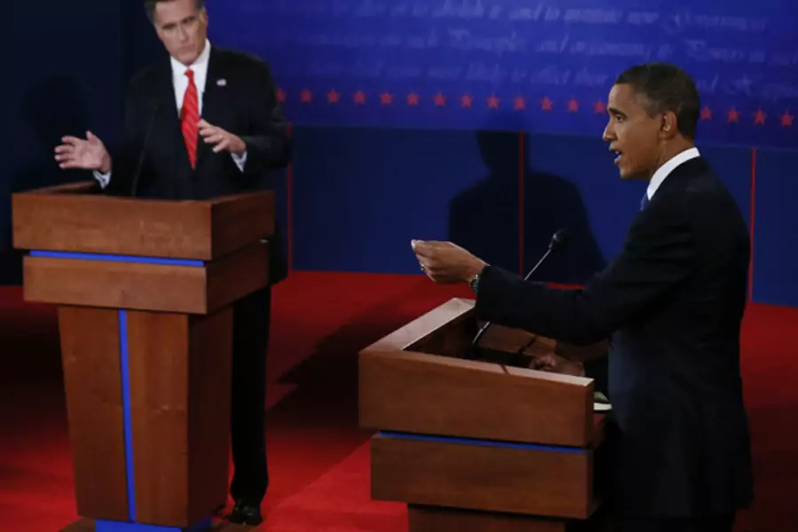 President Barack Obama answers a question as Republican presidential nominee Mitt Romney listens during the first 2012 U.S. presidential debate in Denver on October 3 (Rick Wilking/Courtesy Reuters).