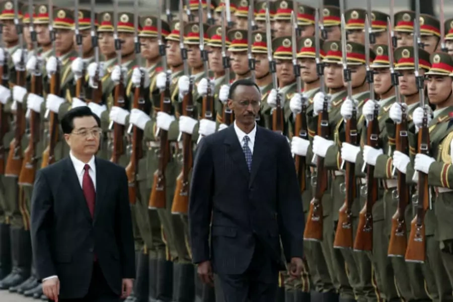 China's President Hu Jintao and Rwanda's President Paul Kagame (R) view an honor guard during a welcome ceremony outside the Great Hall of the People in Beijing on May 14, 2007 (Jason Lee/Courtesy Reuters).