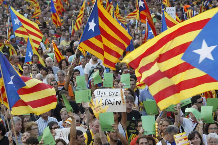 Marchers wave Catalonian nationalist flags during a demonstration on Catalan National Day in Barcelona on September 11, 2012 (Albert Gea/Courtesy Reuters).