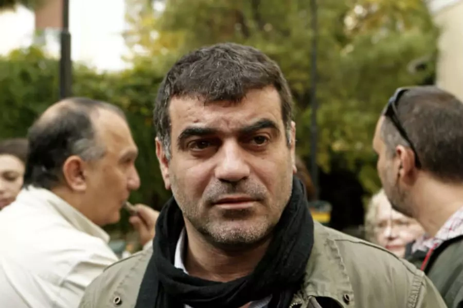 Greek editor Costas Vaxevanis waits outside a courthouse in Athens. 11/01/2012