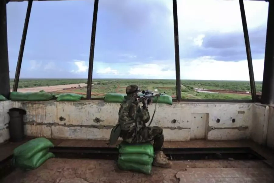 A sniper in a control tower checks surrounding areas for al-Shabaab militants (Handout/Courtesy Reuters).
