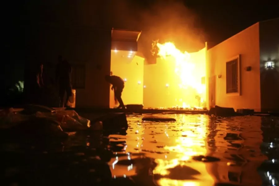 The U.S. Consulate in Benghazi is seen in flames after an attack on September 11, 2012 (Esam Al-Fetori/Courtesy Reuters).
