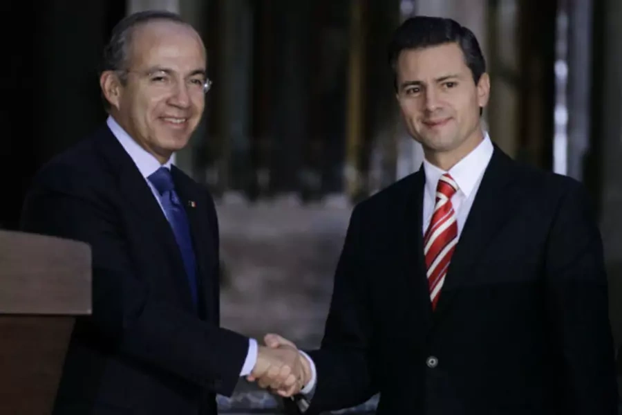 Mexican President Calderon shakes hands with President-elect Pena Nieto after attending a private meeting in Mexico City