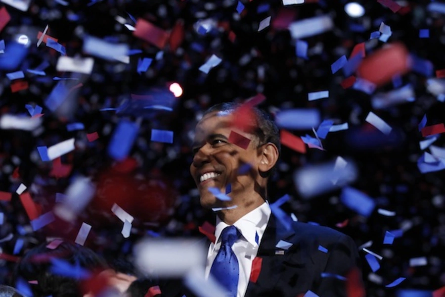 U.S. president Barack Obama celebrates on stage as confetti falls after his victory speech during his election rally in Chicago, November 6, 2012 (Kevin Lamarque/Courtesy Reuters).