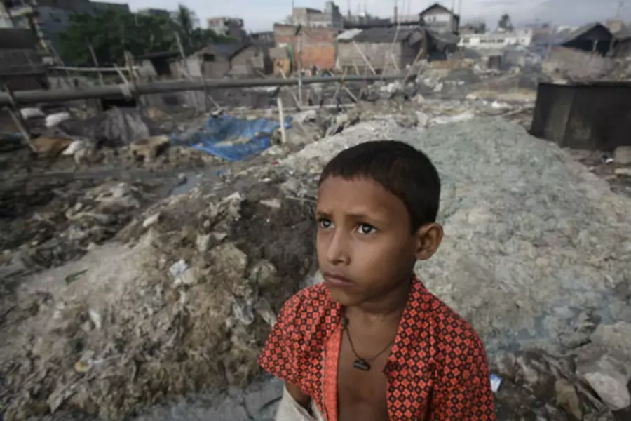 A boy stands in front of the tannery wastes at Hazaribagh in Dhaka, Bangladesh on October 9, 2012 (Andrew Biraj/Courtesy Reuters).