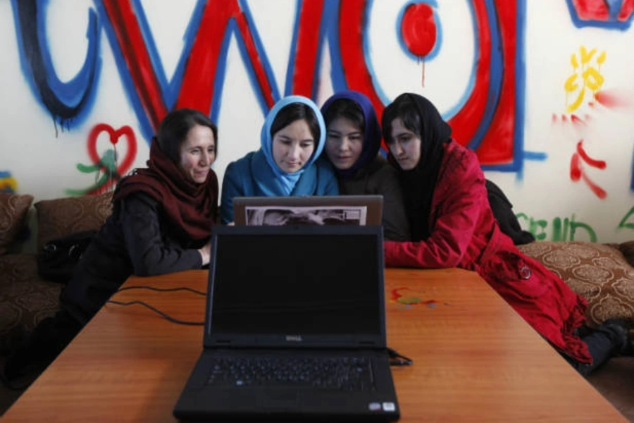 Afghan women work at Aghanistan's first all-female Internet cafe in Kabul on March 8, 2012 (Mohammad Ismail/Courtesy Reuters).