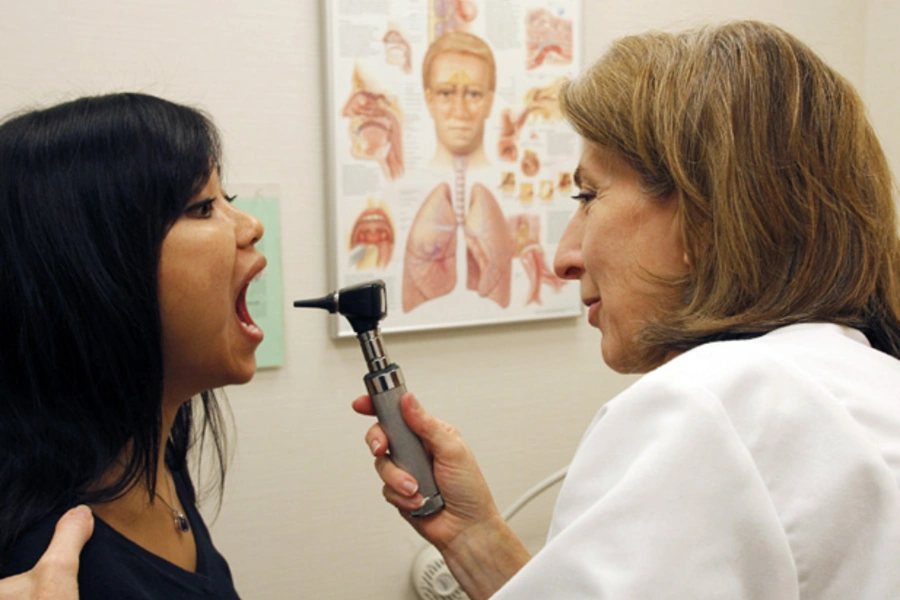 Dr. Liz Sequeira examines a patient at the Discovery Wellness Center in Silver Spring, Maryland (Jim Bourg/Courtesy Reuters).