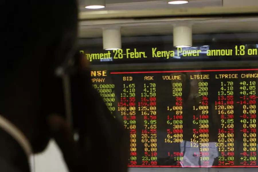 A stockbroker transacts shares during a trading session at the Nairobi Securities Exchange in Kenya's capital Nairobi on January 11, 2012 (Thomas Mukoya/Courtesy Reuters).