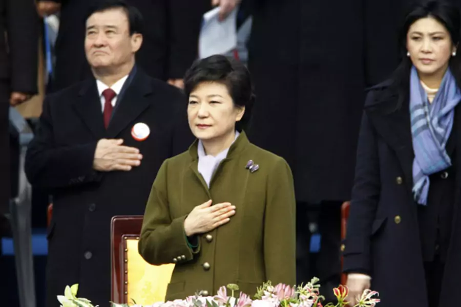 South Korea's new president Park Geun-hye salutes the national flag during her inauguration (Lee Jae-Won/Courtesy Reuters).