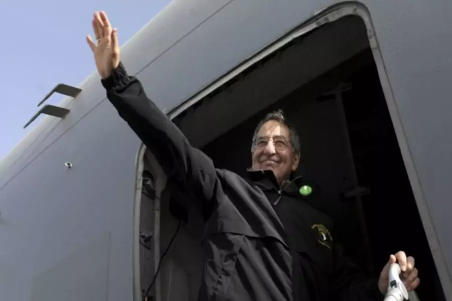 Defense Secretary Leon Panetta waves as he boards his plane on December 12, 2012 (Susan Walsh/Courtesy Reuters).