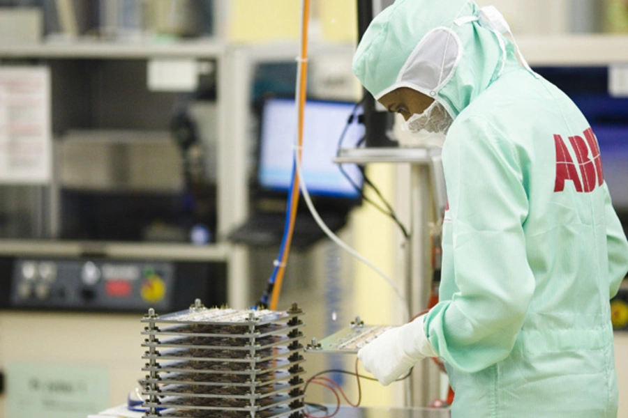 An employee works on the production of high-power semiconductors at a manufacturing plant of Swiss engineering group ABB on May 30, 2012 (Michael Buholzer/Courtesy Reuters).