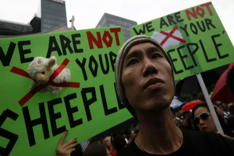 People attend a demonstration against the government’s proposed plan for increased immigration at Speakers' Corner in Singapore February 16, 2013.