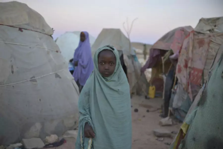 A girl stands in a camp for internally displaced persons (IDP) on the outskirts of Belet Weyne, about 315 km (196 miles) from ...this picture provided by the African Union-United Nations Information Support (AU-UN IST) team (Tobin Jones/Courtesy Reuters).