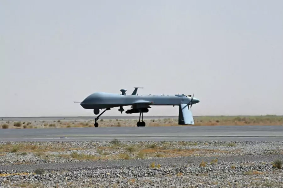A U.S. Predator unmanned drone armed with a missile stands on the tarmac of Kandahar military airport. (Massoud Hossaini/Courtesy Reuters).