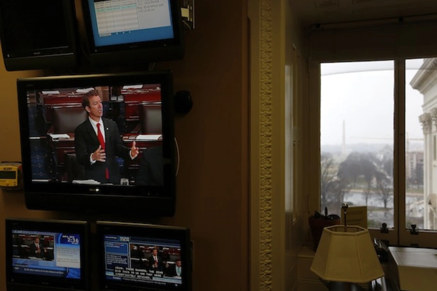 U.S. senator Paul appears on a television screen in an office at the U.S. Capitol as he filibusters in opposition to the nomination of Brennan to lead the CIA on March 6, 2013 (Jonathan Ernst/Courtesy Reuters).