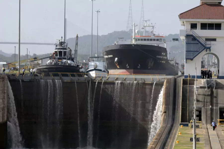 A cargo ship waits to pass through the Miraflores Locks in the Panama Canal (Alberto Lowe/Courtesy Reuters).