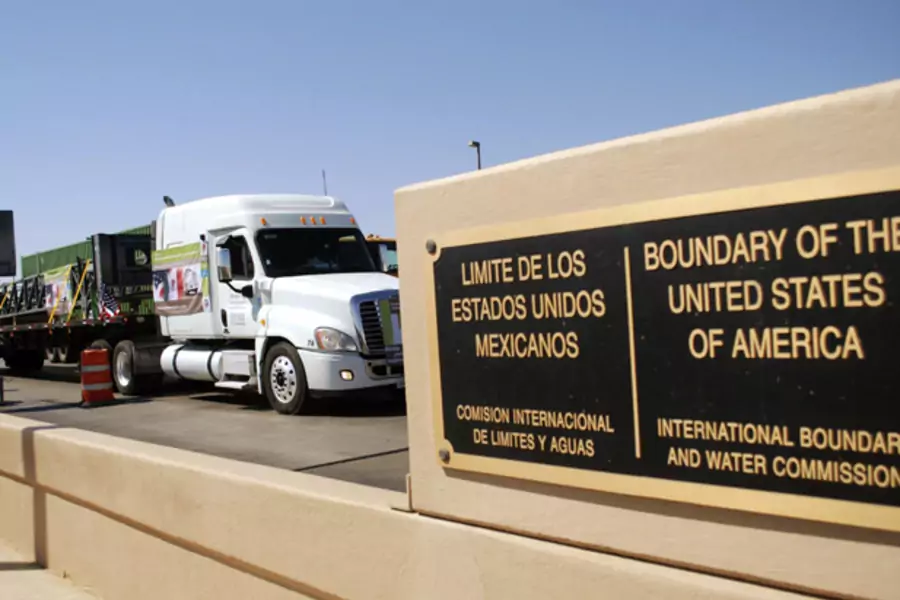 A truck of the Mexican company Olympics approaches the border at Laredo, TX to cross into the United States (Josue Gonzalez/Courtesy Reuters).