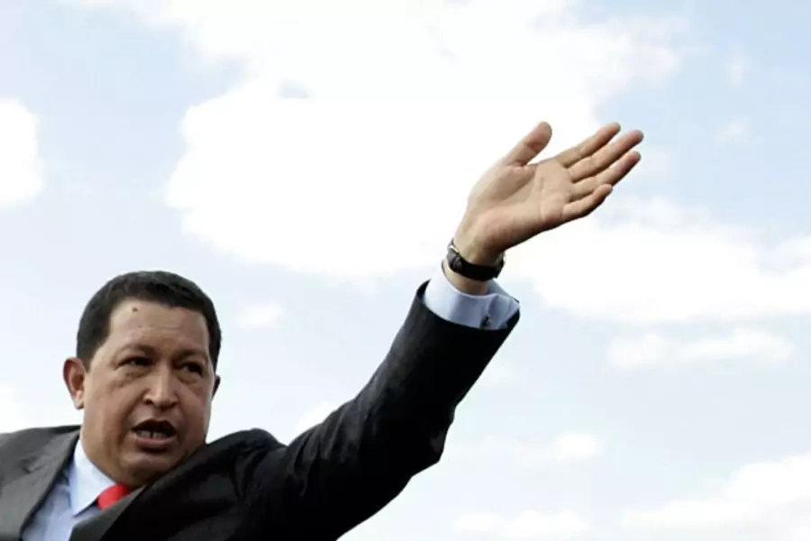 Venezuela's President Hugo Chavez waves to supporters during his arrival at Toncontin airport in Tegucigalpa (Edgard Garrido/Courtesy Reuters)