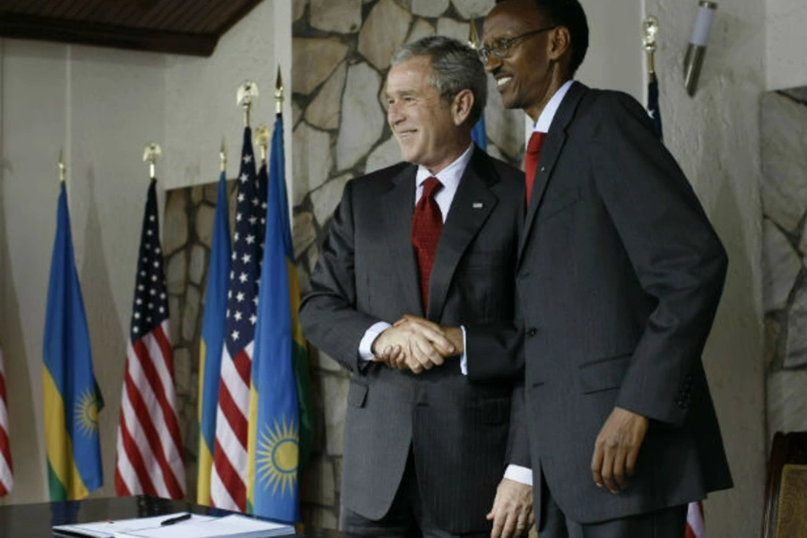 U.S. President George W. Bush shakes hands with Rwandan President Paul Kagame after signing a bilateral investment treaty during a news conference at the Presidency in Kigali February 19, 2008 (Jason Reed/Courtesy Reuters).
