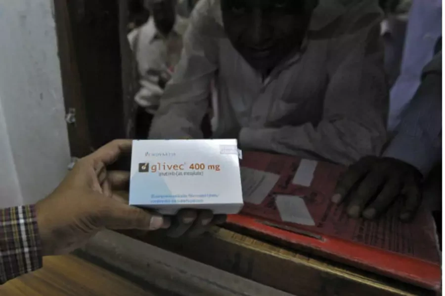 A man buys cancer drug Glivec for a relative who is suffering from cancer at a pharmacy in a government-run hospital in the western Indian city of Ahmedabad on April 2, 2013 (Amit Dave/Courtesy Reuters).