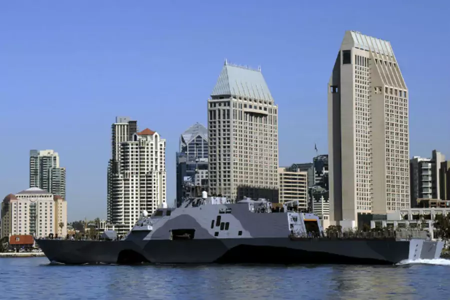 The littoral combat ship USS Freedom (LCS 1) departs for a deployment to the Asia-Pacific region, in San Diego Bay, California. (Christine Walker-Singh/Courtesy Reuters).