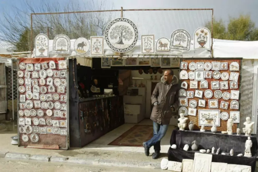 A man waits for tourists to visit his souvenir shop in Carthage, near Tunis, Tunisia February 10, 2013 (Zoubeir Souissi/Courtesy Reuters).