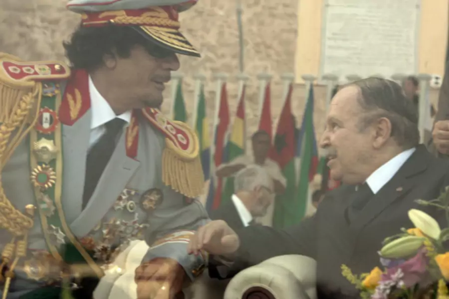 Libya's leader Muammar Gaddafi (L) talks to Algeria's President Abdelaziz Bouteflika during celebrations of the 40th anniversary of Gaddafi coming to power, at the Green Square in Tripoli September 1, 2009. (Courtesy REUTERS/Zohra Bensemra)
