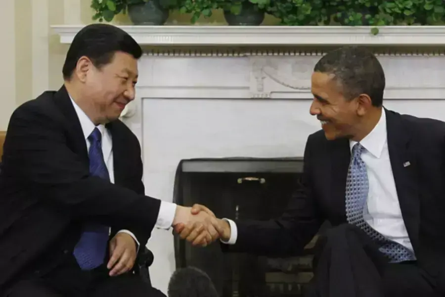 President Barack Obama shakes hands with then-Vice President of China Xi Jinping in the Oval Office on February 14, 2012 (Jason Reed/Courtesy Reuters).