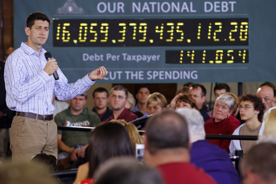 U.S. Congressman Paul Ryan (R-WI) speaks in front of the "national debt clock" in New Hampshire, September 2012 (Brian Snyder/Courtesy Reuters.)