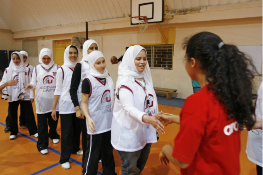 Saudi Arabia's Jeddah United (in white) shake hands with Jordan's Al Reyadeh before their friendly basketball game in Amman on April 21, 2009 (Ali Jarekji/Courtesy Reuters).