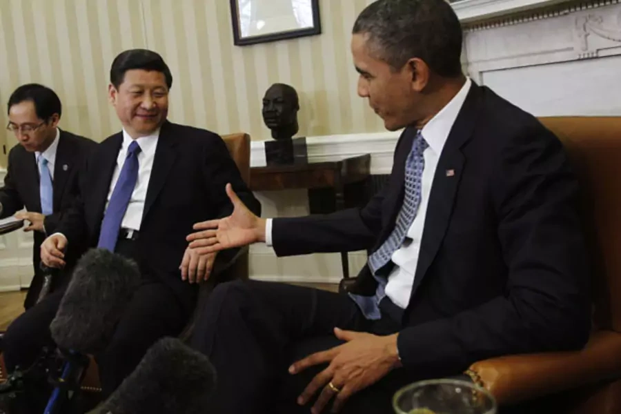 Barack Obama prepares to shake hands with Xi Jinping in the Oval Office (Jason Reed/Courtesy Reuters).