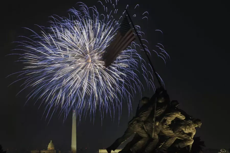 Fireworks light up the sky over Washington, seen from the U.S. Marine Corps Memorial in Arlington, Virginia (Jonathan Ernst/Courtesy Reuters).