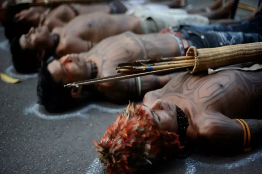 Amazon Indians in front of the Ministry of Mines and Energy in Brasilia, Brazil, protesting the construction of the Belo Monte hydroelectric plant, June 2013 (Courtesy Reuters/Lunae Parracho).