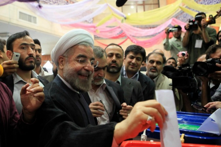 Presidential candidate Hassan Rouhani casts his ballot during the Iranian presidential election, June 14, 2013 (Yalda Moayeri/Courtesy Reuters)