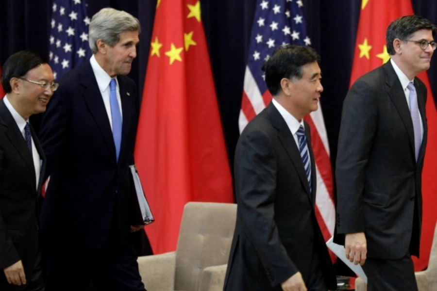 (L-R) Chinese State Councilor Yang Jiechi, U.S. Secretary of State John Kerry, Chinese Vice Premier Wang Yang and U.S. Treasur...c Dialogue (S&ED) Joint Opening Session at the State Department in Washington on July 10, 2013. (Courtesy Yuri Gripas/Reuters)
