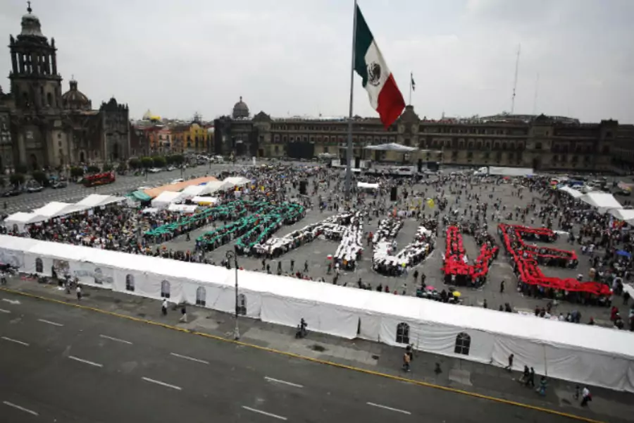 Supporters of Andrés Manuel López Obrador, runner up in Mexico's recent presidential election, come together to form the word FRAUD as part of the "Expo Fraud" at Zocalo square in Mexico City, August 12, 2012 (Stringer/Courtesy Reuters).