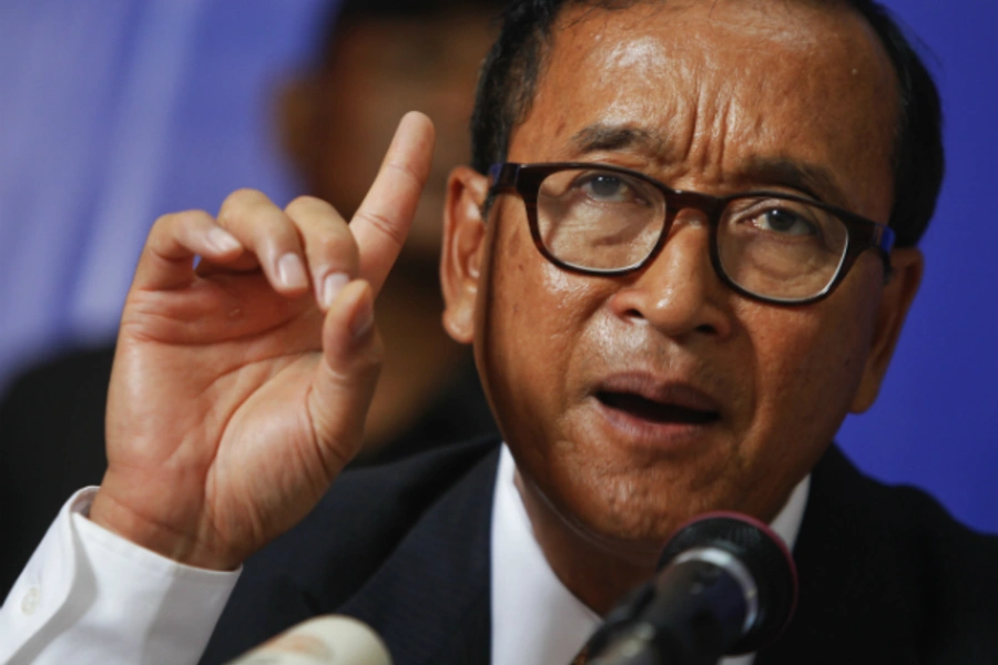 Sam Rainsy, president of the Cambodia National Rescue Party (CNRP) makes a point as he addresses reporters at his party's head...d won, and called for an inquiry into what it called massive manipulation of electoral rolls. (Pring Samrang/Courtesy Reuters)