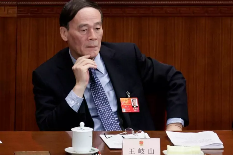 Wang Qishan, now China's anti-corruption chief, attends a plenary meeting of the National People's Congress at the Great Hall of the People in Beijing on March 8, 2012.