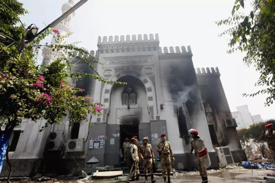 Military police stand outside the Rabaa Adawiya mosque in Cairo on August 15 (Mohamed Abd El Ghany/ Courtesy Reuters).