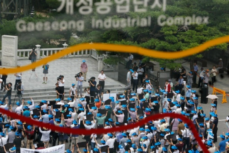 Protesters comprising of South Korean employers and employees working at factories in the Kaesong Industrial Complex (KIC) ins...e demilitarized zone which separates the two Koreas, in Paju, north of Seoul on August 7, 2013. (Courtesy Reuters/Kim Hong-ji)