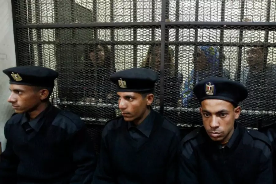 NGO workers behind bars in Egypt, February 2012 (Courtesy Reuters/Mohamed Abd El Ghany).